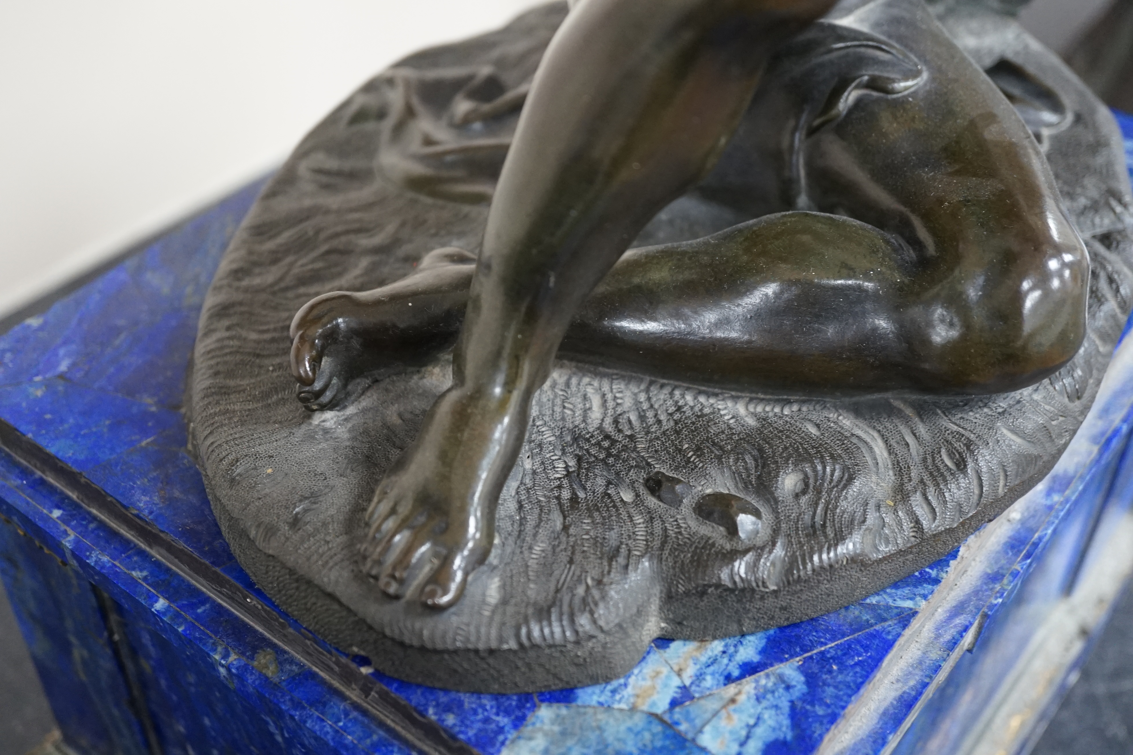 After the antique, a pair of late 18th/early 19th century Grand Tour souvenir bronze figures of seated warriors